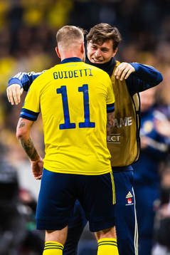 John Guidetti of Sweden celebrates scoring 3-0 and hugs