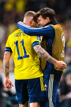 John Guidetti of Sweden celebrates scoring 3-0 and hugs