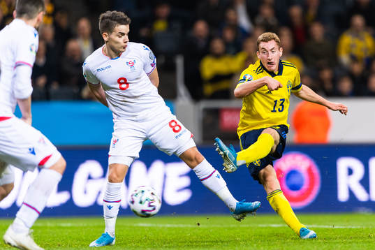 Brandur Hendriksson Olsen of Faroe Islands defends against