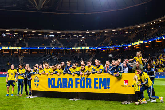 Players of Sweden celebrate with a sign
