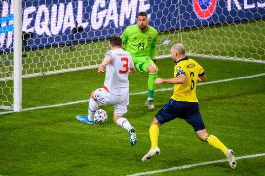 Viljormur Davidsen of Faroe Islands against goalkeeper