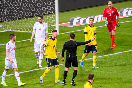 Pontus Jansson of Sweden reacts against referee Matej Jug