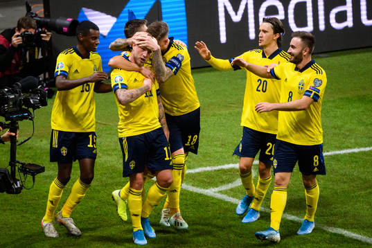 John Guidetti of Sweden celebrate with teammates