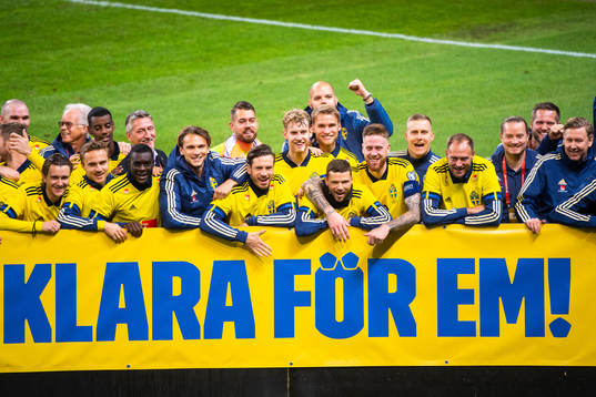 Players and staff of Sweden celebrate