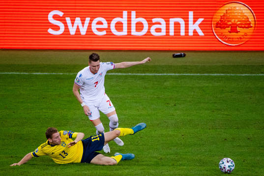 Dejan Kulusevski of Sweden and Kaj Leo Bartalsstovu of