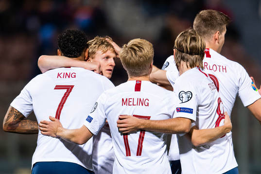 Joshua King of Norway celebrates with team mates