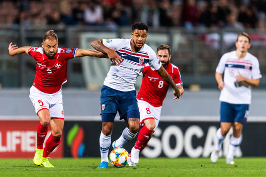 Andrei Agius of Malta and Joshua King of Norway compete for