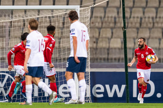 Paul Fenech of Malta celebrates scoring 1-1