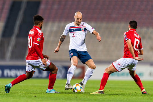 Kyrian Nwoko and Dusten Vella of Malta defend against Tore