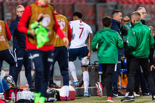Joshua King of Norway leaves the arena with an injury
