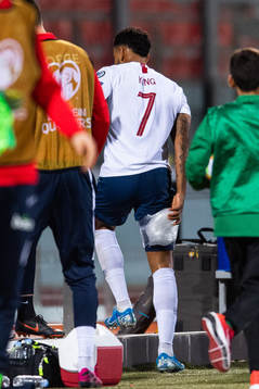 Joshua King of Norway leaves the arena with an injury