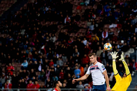 Alexander Sørloth of Norway and goalkeeper Henry Bonello