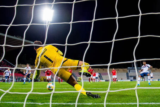 Goalkeeper Henry Bonello of Malta saves a penalty kick from
