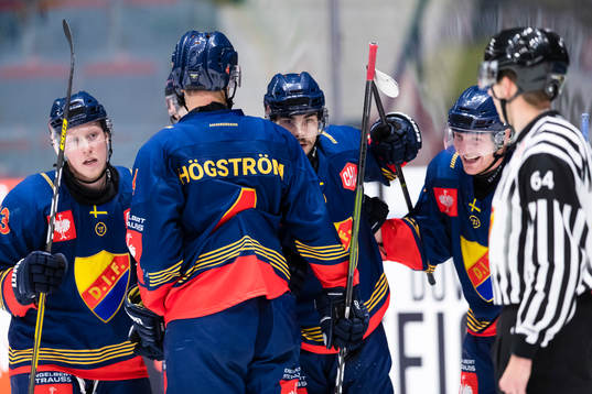 nd right), scores 2-0 and celebrates with team mates
