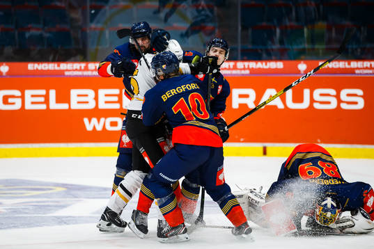 Linus Lindström of Skellefteå fights Patrik Berglund and