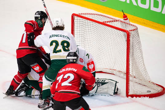 Nicklas Lasu of Frölunda scores 6-2 behind goalkeeper