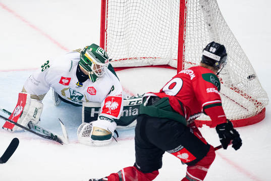 Simon Hjalmarsson of Frölunda scores 2-0 behind goalkeeper