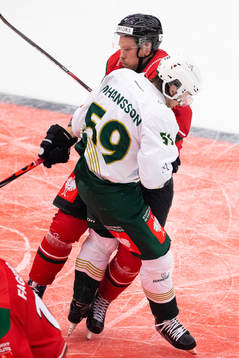 Linus Johansson of Färjestad gets hit by Viktor Ekbom of