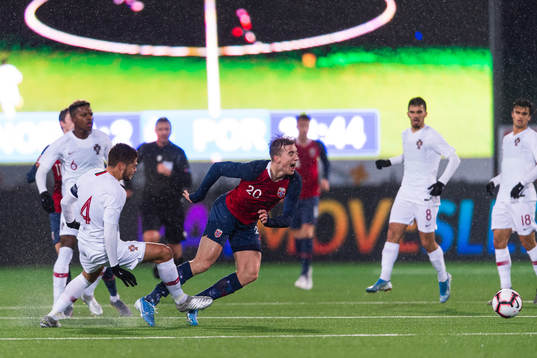 Diogo Queiros of Portugal tackles Kristian Thorstvedt of