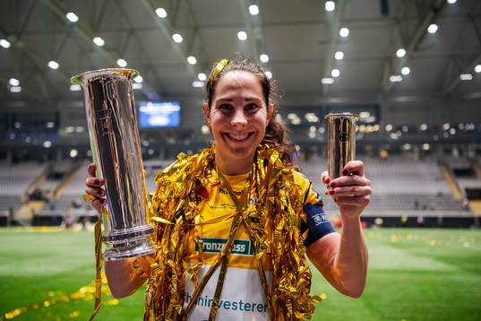 Ingrid Moe Wold of LSK Kvinner celebrates with the trophy