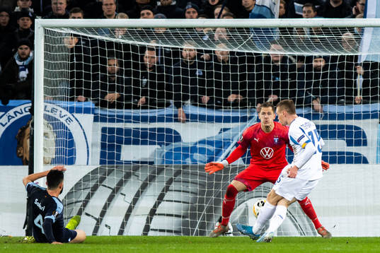Viktor Tsyganov of Dynamo Kiev scores 1-2 behind goalkeeper