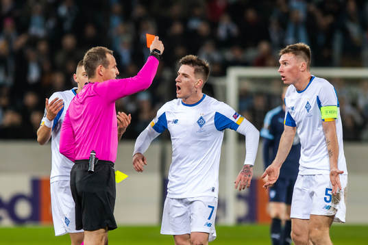 Serhiy Sydorchuk of Dynamo Kiev is shown a red card from