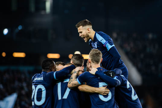 Arnor Traustason of Malmö FF celebrate with teammates