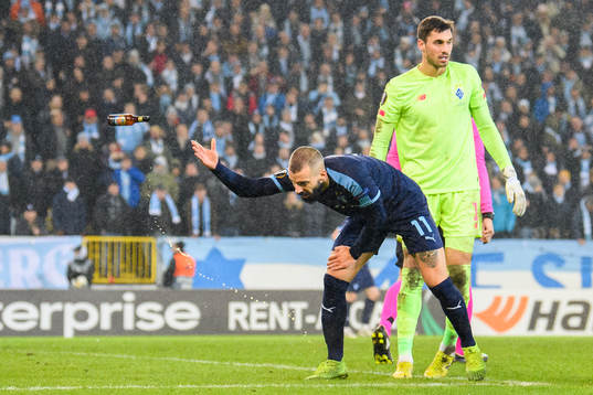 Guillermo Molins of Malmö FF tosses a bottle that has been