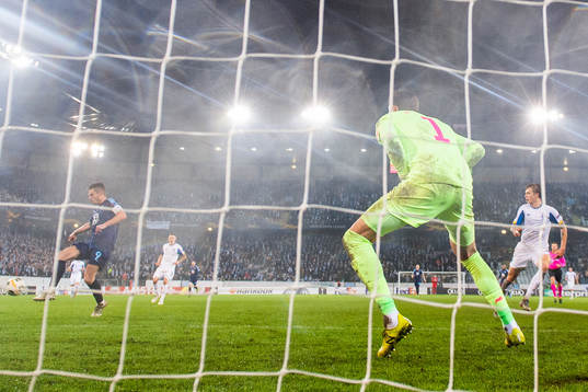 Markus Rosenberg of Malmö FF scores 4-3 behind goalkeeper