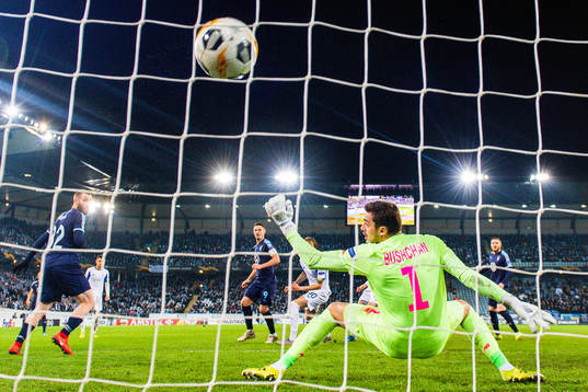 Markus Rosenberg of Malmö FF scores 2-2 behind goalkeeper