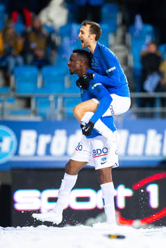 Leke Samson James and Magnus Eikrem of Molde celebrate the