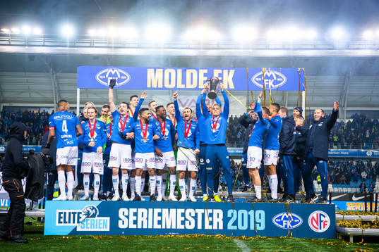 Players of Molde celebrate with the trophy
