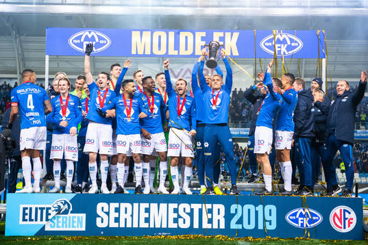 Players of Molde celebrate with the trophy