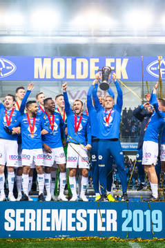 Players of Molde celebrate with the trophy