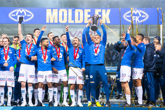 Players of Molde celebrate with the trophy
