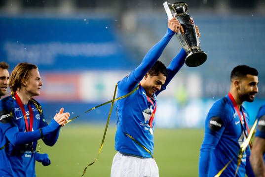 Henry Wingo of Molde celebrates with the trophy