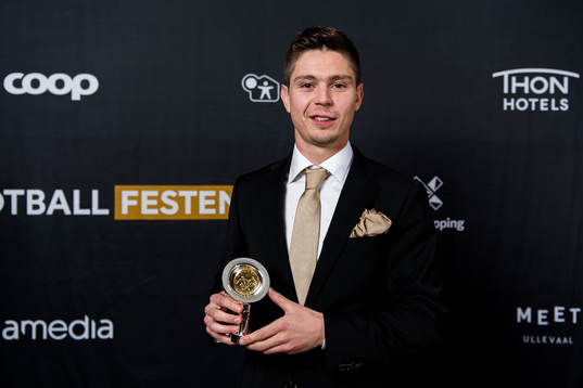 Torgeir Børven of Odd poses for a portrait with the award
