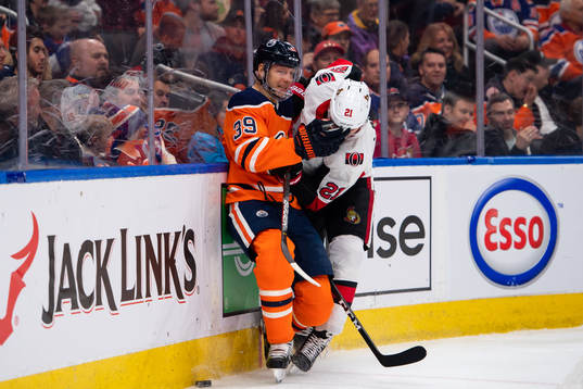 Alex Chiasson of the Edmonton Oilers and Logan Brown of the