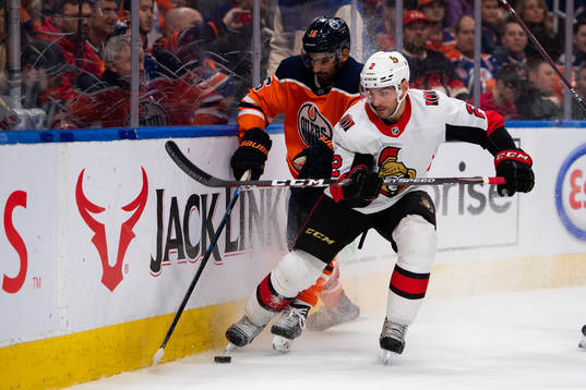 Jujhar Khaira of the Edmonton Oilers and Dylan DeMelo of