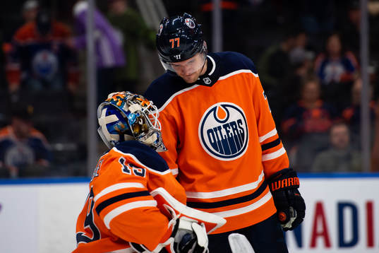 Oscar Klefbom of the Edmonton Oilers with goaltender Mikko