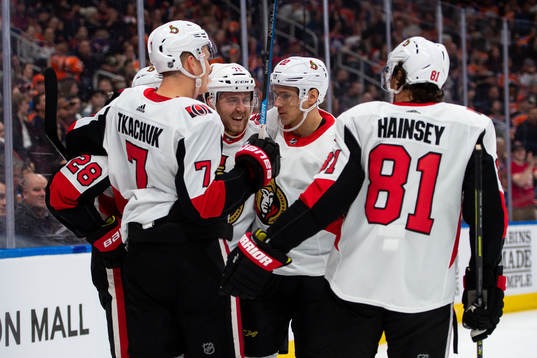 Chris Tierney and Nikita Zaitsev of the Ottawa Senators