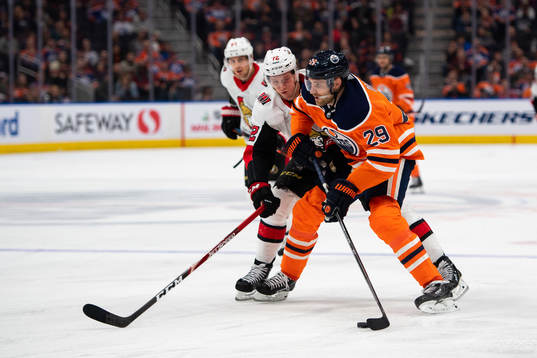 Thomas Chabot of the Ottawa Senators  and Leon Draisaitl of