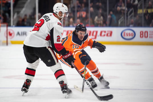 Dylan DeMelo of the Ottawa Senators  and Joakim Nygard of