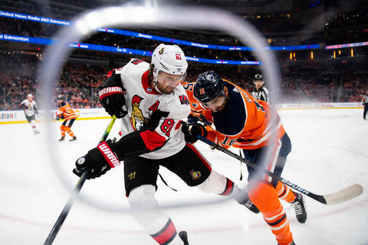Ron Hainsey of the Ottawa Senators  and Jujhar Khaira of