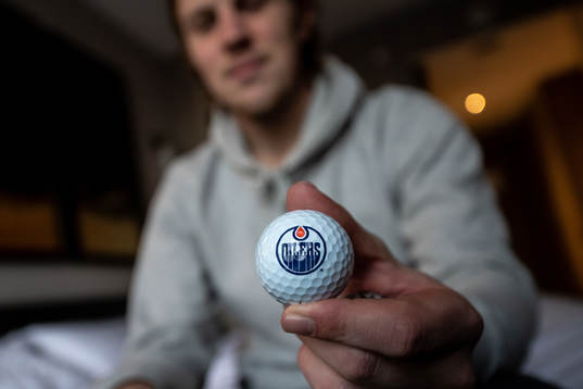 Joel Persson of the Edmonton Oilers with a golfball with