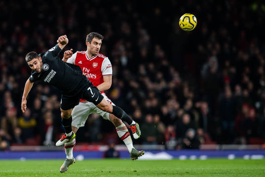 Neal Maupay of Brighton and Sokratis of Arsenal