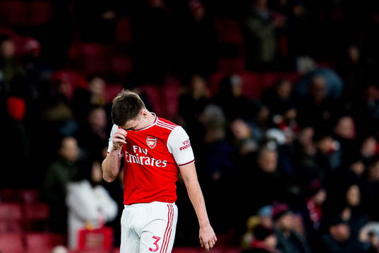 Kieran Tierney of Arsenal looks dejected