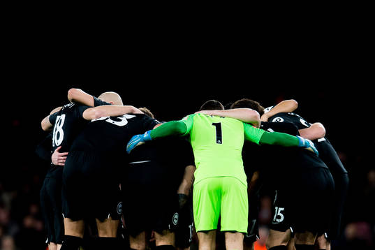 Goalkeeper Mathew Ryan and the players of Brighton gather