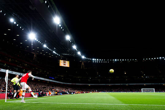 Mesut Özil of Arsenal takes a corner kick