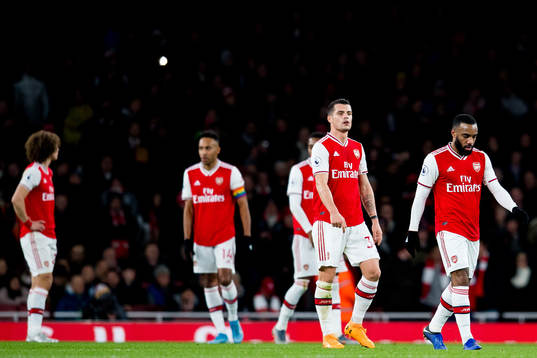 Granit Xhaka and Alexandre Lacazette of Arsenal look